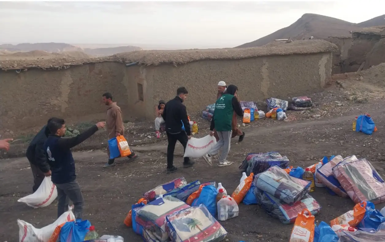 Volunteers distributing relief supplies in rural area.